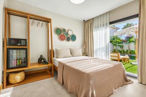 a bedroom with a bed and a large window at Meruno Alaçatı in Çeşme +19 photos