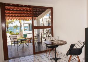 a patio with a table and chairs on a deck at Hotel Allende in La Paz