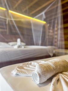 Postel nebo postele na pokoji v ubytování Hostal MOCAMBO BEACH