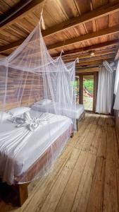 Postel nebo postele na pokoji v ubytování Hostal MOCAMBO BEACH