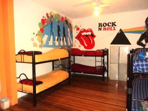 a room with three bunk beds in a room at Play Hostel Soho in Buenos Aires