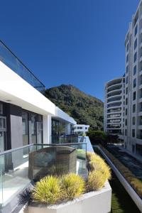 a view from the balcony of a building at Eleven_at_Mauao in Mount Maunganui