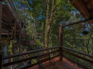 a view from the deck of a tree house at Pousada Recanto do Escorrega in Visconde De Maua