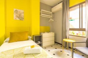 Postel nebo postele na pokoji v ubytování Hostal Tropical