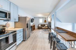 a kitchen with white cabinets and a counter top at Waterfront Lake Hamilton Vacation Rental with Dock! in Royal