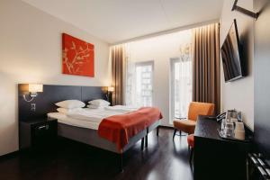 a bedroom with a large bed in a room at Best Western Malmo Arena Hotel in Malmö +112 photos