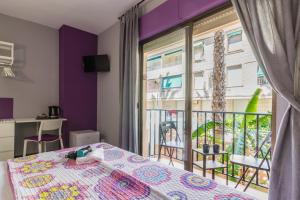 Postel nebo postele na pokoji v ubytování Hostal Tropical