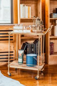 a table in a room with a shelf with books at Stunning Couples Retreat Lodge in Milford