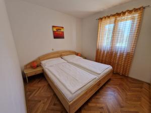 Postel nebo postele na pokoji v ubytování Apartment Jozic