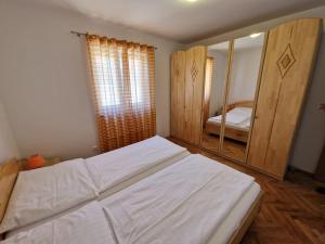 Postel nebo postele na pokoji v ubytování Apartment Jozic