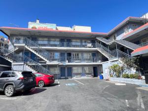 a parking lot in front of a building with stairs at Travelodge by Wyndham by Fisherman's Wharf in San Francisco