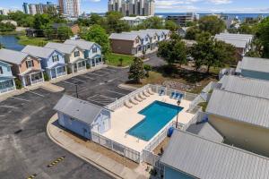 an aerial view of a house with a swimming pool at 2 Bedroom Coastal Cottage 1 block to the beach in Myrtle Beach