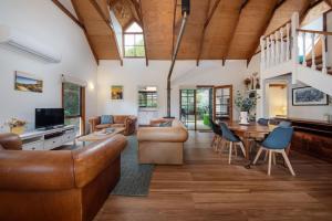 a living room with a couch and a table at The Observation Loft at Rye in Rye