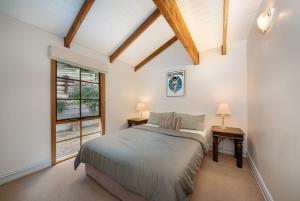 a bedroom with a bed and a window at The Observation Loft at Rye in Rye