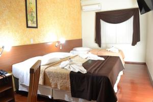 Postel nebo postele na pokoji v ubytování Hotel Rafeli