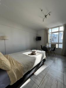 Ένα ή περισσότερα κρεβάτια σε δωμάτιο στο Center Apartment Studio