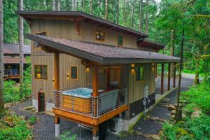a small house in the middle of a forest at Elysian at Mount Baker in Glacier