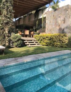 Bazén v ubytování Alquiler Casa de Campo Cieneguilla Exclusiva nebo v jeho okolí