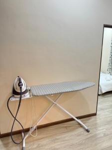 a metal table with a hose attached to it at Rumah Tuma in Shah Alam