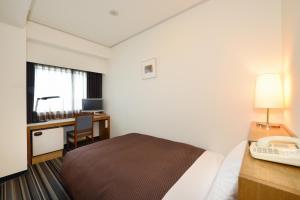 Letto o letti in una camera di Nagoya Creston Hotel