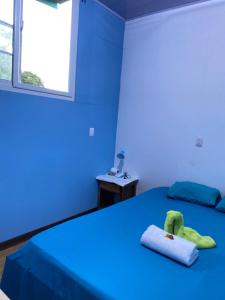 Кровать или кровати в номере Cabinas Mitchaelle's