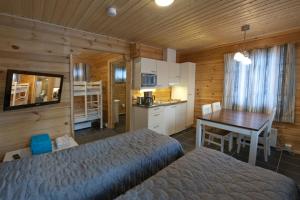 Kuchyň nebo kuchyňský kout v ubytování Kajaani Cottages
