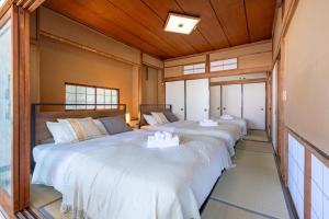 En eller flere senge i et værelse på Villa Katsushikaお花茶屋駅徒歩10分