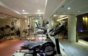 a fitness room with a gym with a treadmill at ASIA The HERITAGE in Jammu