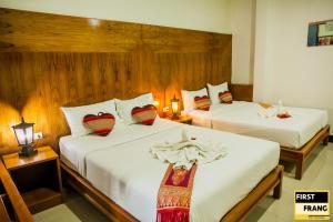 First and Frang Hotel - Koh Phangan客房内的一张或多张床位