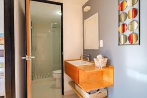 a bathroom with a sink and a toilet and a mirror at Deluxe Apartment W Private Terrace Reforma Av in Mexico City +27 photos