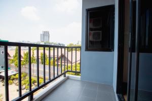 a balcony with a view of a city at Room 36 service apartment in Bangkok