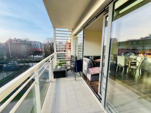 a balcony with a view of a city at Luciano Old Town - City center, Patio & Parking in Gdańsk
