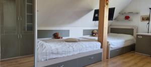 a bedroom with a bed and a mirror at Sweet Home in Koknese