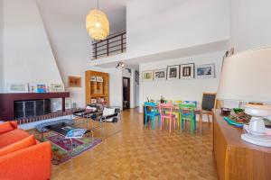 a living room with a table and chairs at BoReal Apartments in Paradiso
