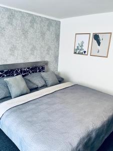 Postel nebo postele na pokoji v ubytování Apartmány na Zahradní