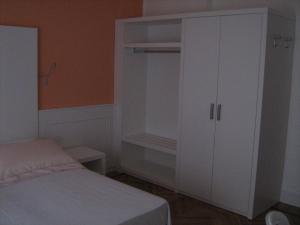 Postel nebo postele na pokoji v ubytování Affittacamere Via Mazzini