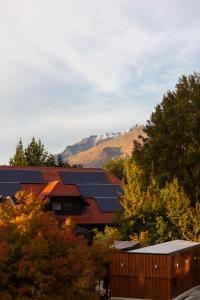 a group of buildings with solar panels on their roofs at Sherwood in Queenstown