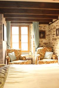 เตียงในห้องที่ Moulin Du David