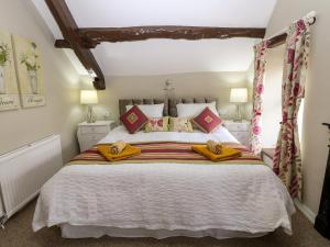 Postel nebo postele na pokoji v ubytování River Cottage