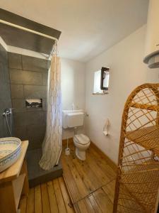 a bathroom with a toilet and a sink and a shower at Heat Hostel in Susak
