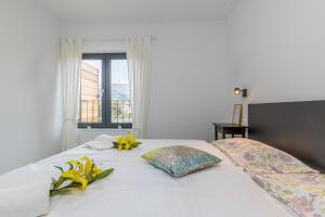 Posteľ alebo postele v izbe v ubytovaní Sapore Di Mare Apartments