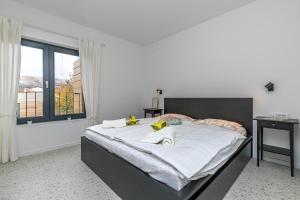 Posteľ alebo postele v izbe v ubytovaní Sapore Di Mare Apartments