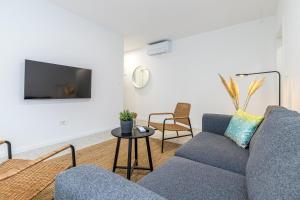 Televízia a/alebo spoločenská miestnosť v ubytovaní Sapore Di Mare Apartments