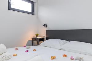 Posteľ alebo postele v izbe v ubytovaní Sapore Di Mare Apartments