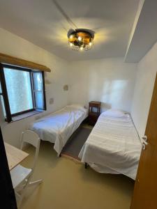 Postel nebo postele na pokoji v ubytování Heat Hostel