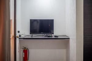 TV a/nebo společenská místnost v ubytování Dreamshore Ki'wi Beach Resort