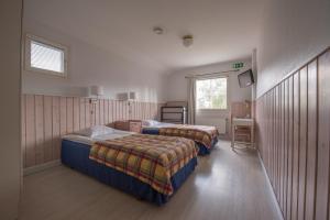 Кровать или кровати в номере Hotel Strandbo