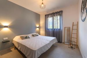 En eller flere senge i et værelse på Casa Omigna