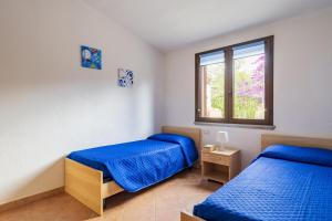 Ένα ή περισσότερα κρεβάτια σε δωμάτιο στο Villetta Macondo +17 φωτογραφίες