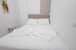 Una cama o camas en una habitación de Porto Heli Sea Getaway - Port House G